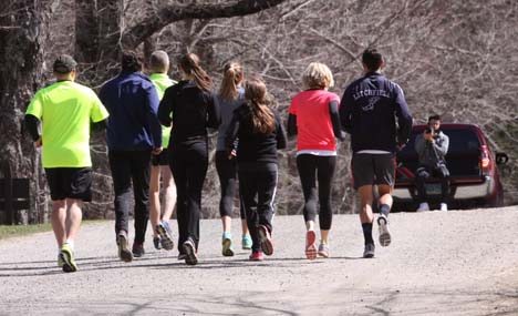 Runners race through the woods in summer series