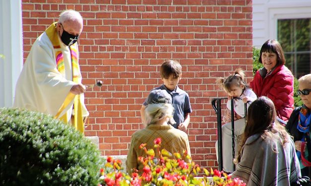 Monsignor Tucker blesses the animals
