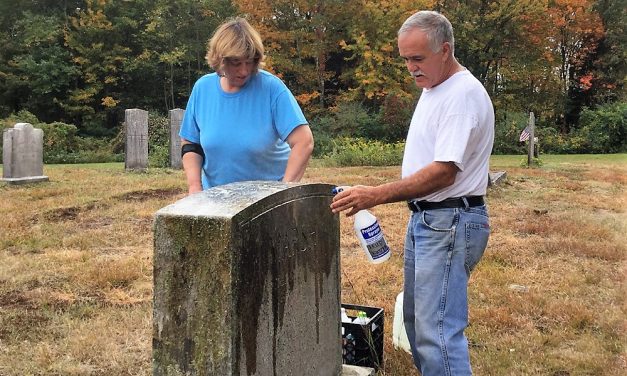Couple cleans grave of the Marsh family