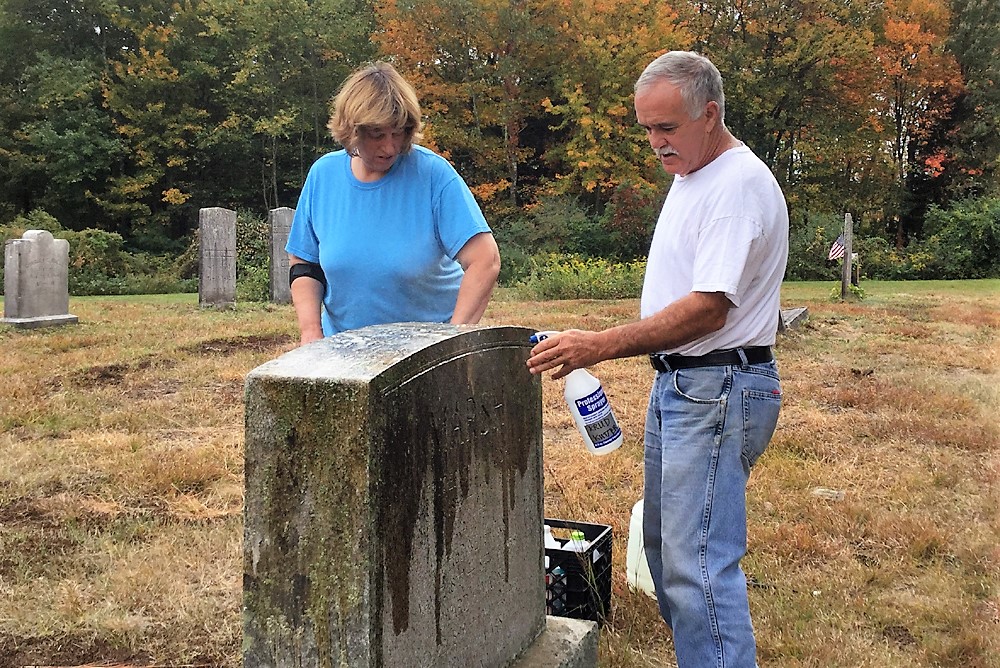 Couple cleans grave of the Marsh family