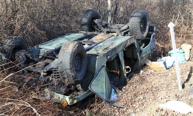 Humvee rolls over; driver busted by cops