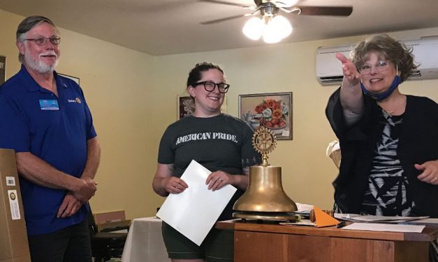 Rotary greets new member, presents honor