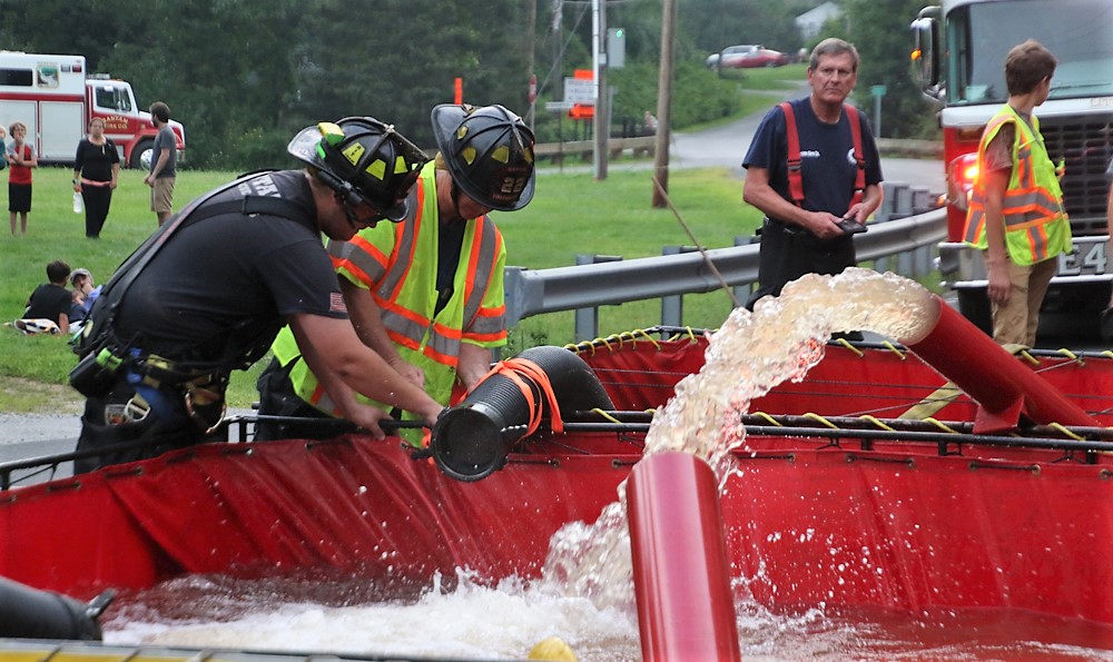 Firefighters move water in Milton exercise