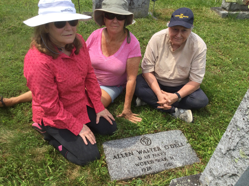 Volunteers clean Allen O’Dell’s gravestone