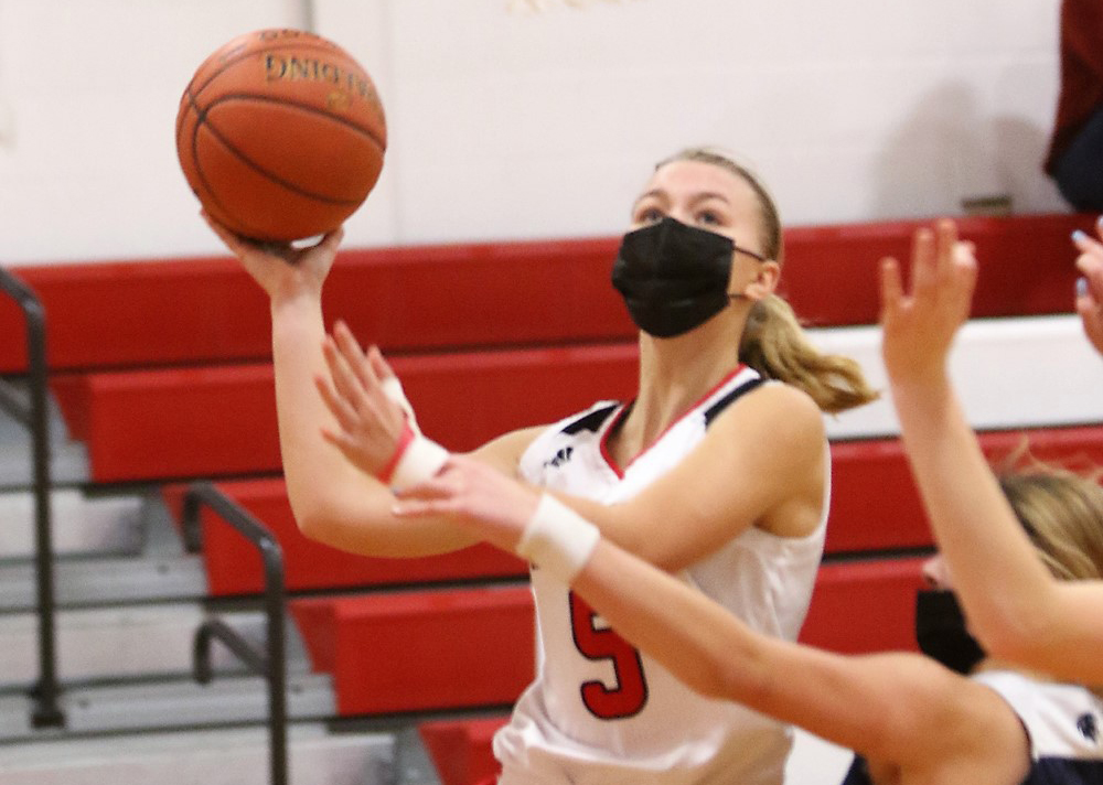 Behind Brady, Wamogo wins first game