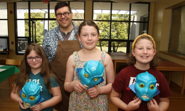 Students learn from a professional artist
