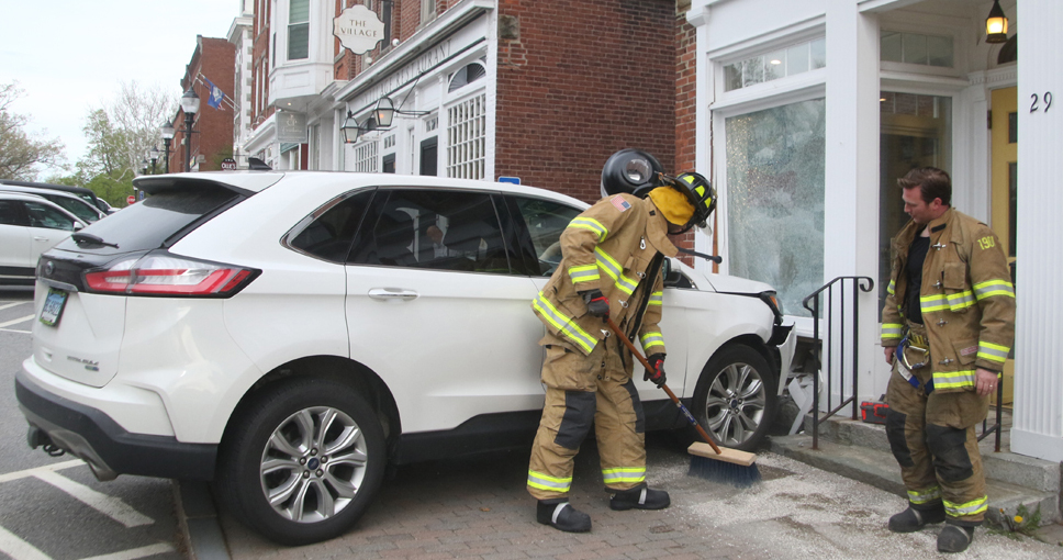 SUV mounts sidewalk, strikes building