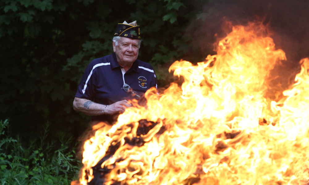 U.S. flags, worn and torn, retired by fire