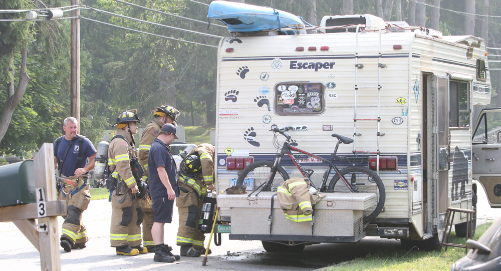 Firefighters douse fire in camper van wall