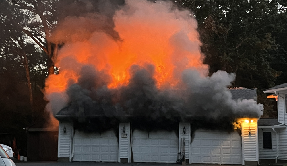 Fire destroys garage, but house saved