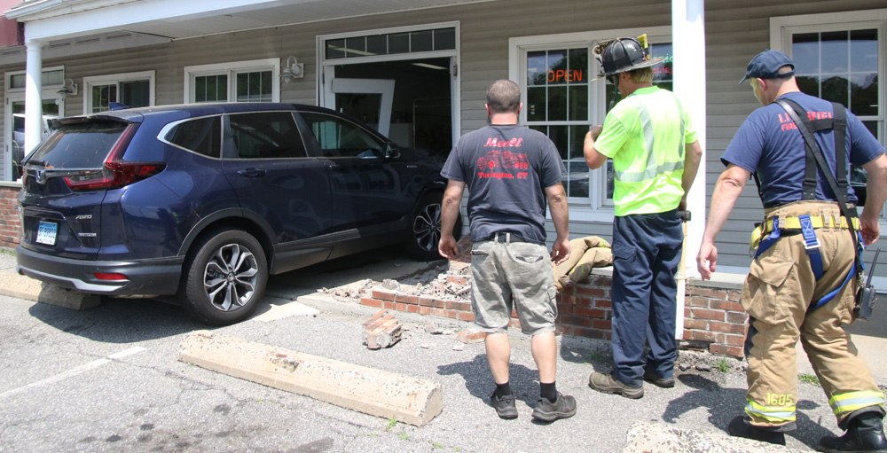 Vehicle strikes building at Village Green