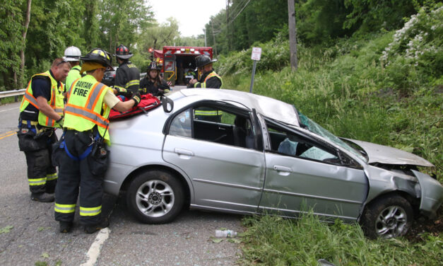 Car rolls over on Route 202, driver unhurt