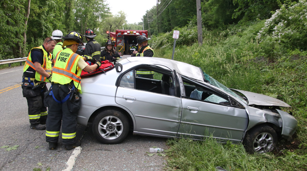 Car rolls over on Route 202, driver unhurt