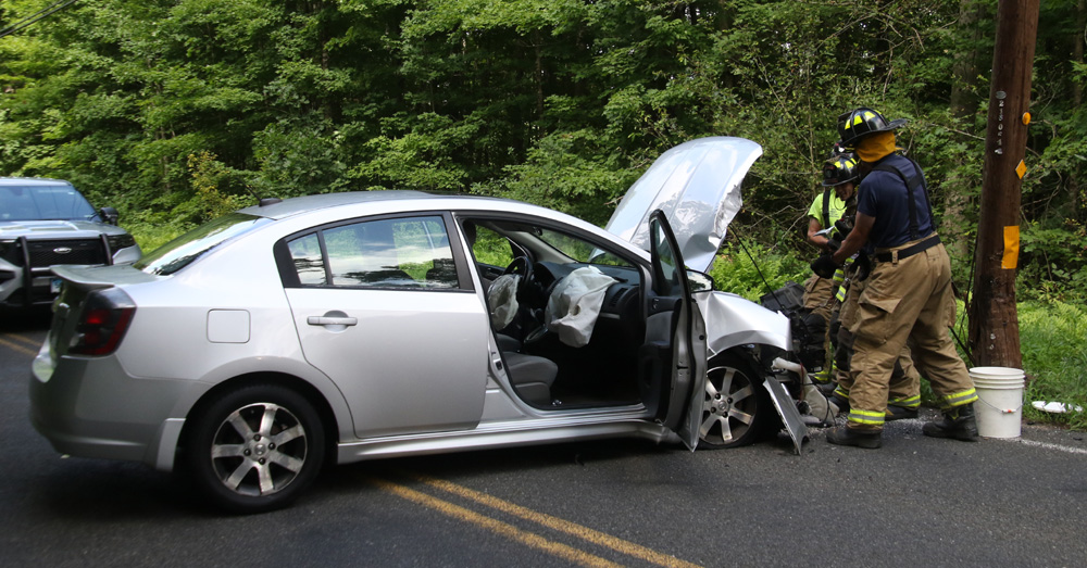 Car hits utility pole on Alain White Road