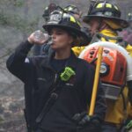 Local firefighters help smother brush fire