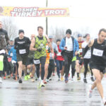 Runners brave a cold rain in Turkey Trot