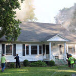 Strong stop: Firefighters halt a house fire