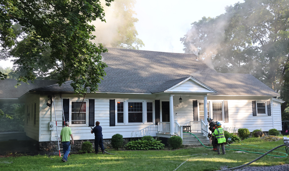 Strong stop: Firefighters halt a house fire