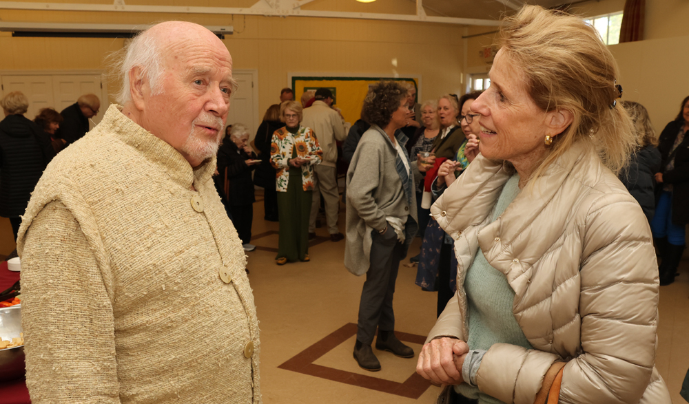Paul Winter greets benefit concert guests