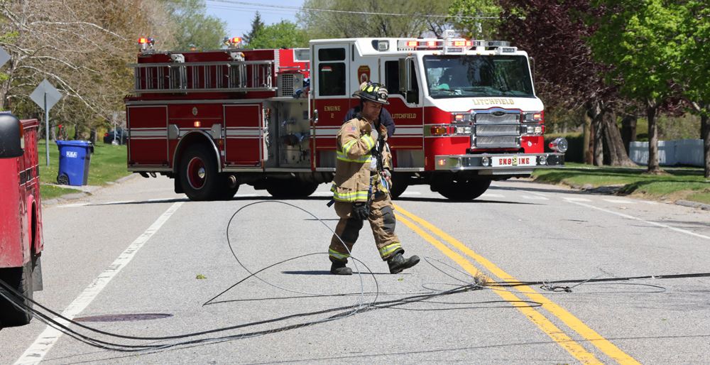 Truck pulls down wires on North Street