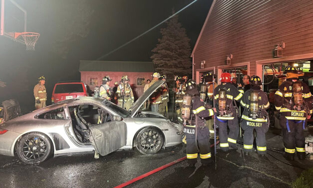 Garage fire damages two cars in Warren