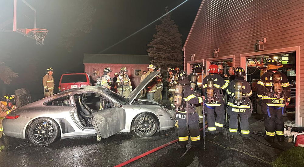 Garage fire damages two cars in Warren