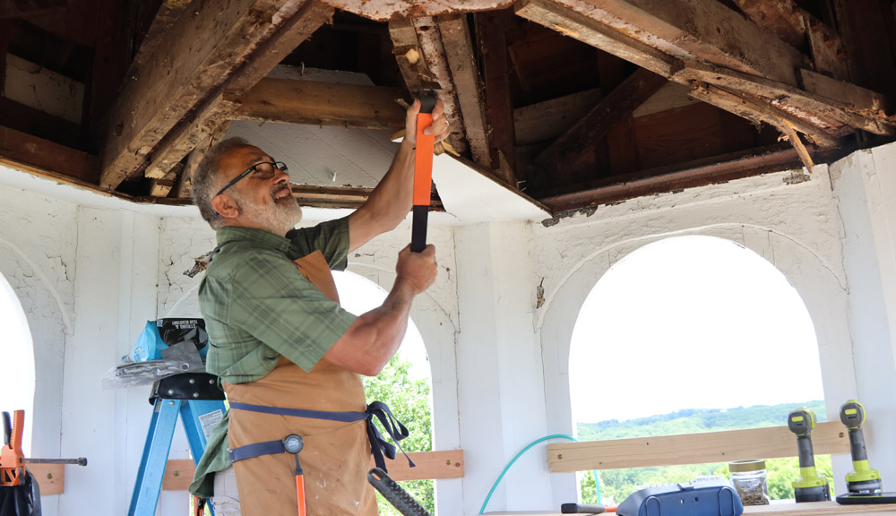 Pastor putting his carpenter skills to work