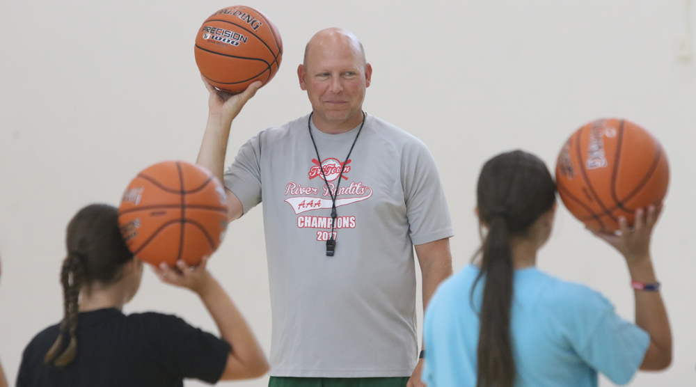 Hoop camp teaching girls the basics