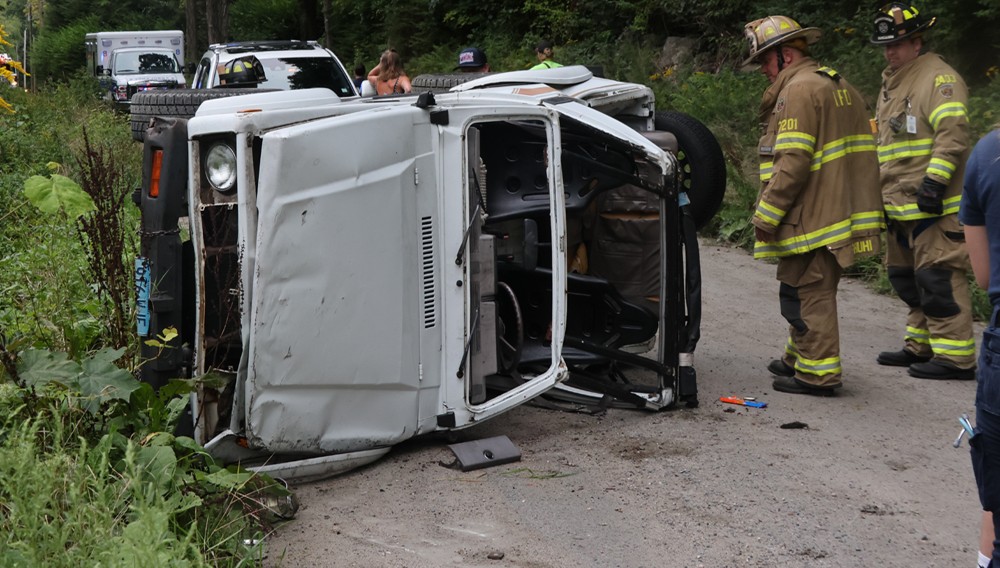 One hospitalized after dirt road crash
